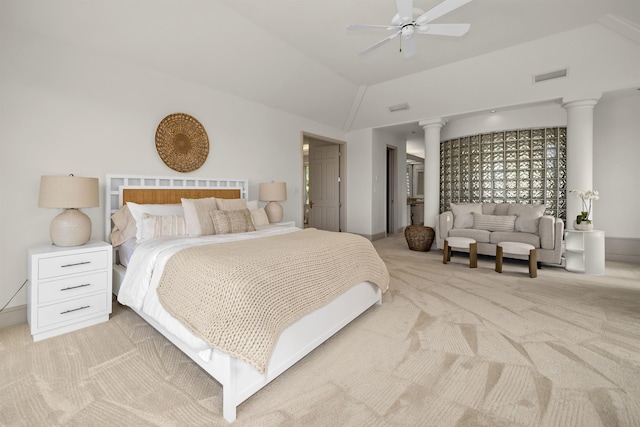 bedroom featuring light colored carpet, vaulted ceiling, visible vents, and decorative columns