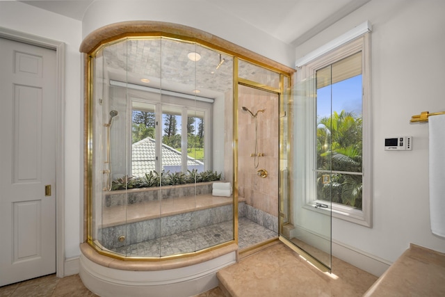 bathroom with a tile shower