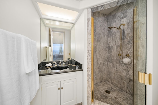 full bathroom featuring a stall shower and vanity