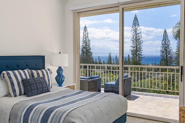 bedroom featuring a water view