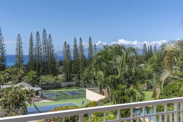 balcony featuring a tennis court