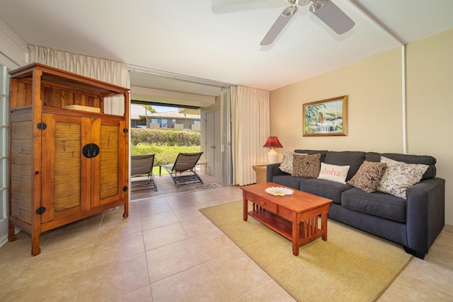 tiled living room with ceiling fan