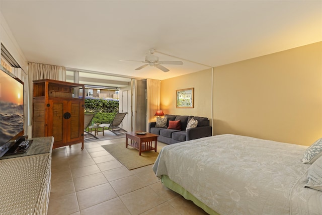 bedroom with light tile patterned floors, access to exterior, and ceiling fan