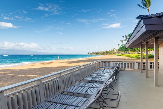 view of patio with a view of the beach and a water view