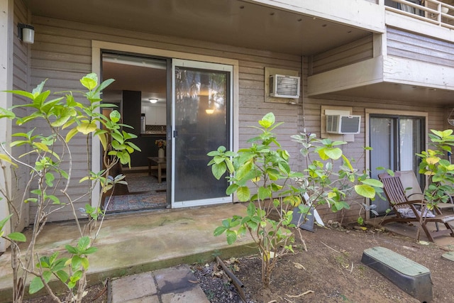 entrance to property with an AC wall unit