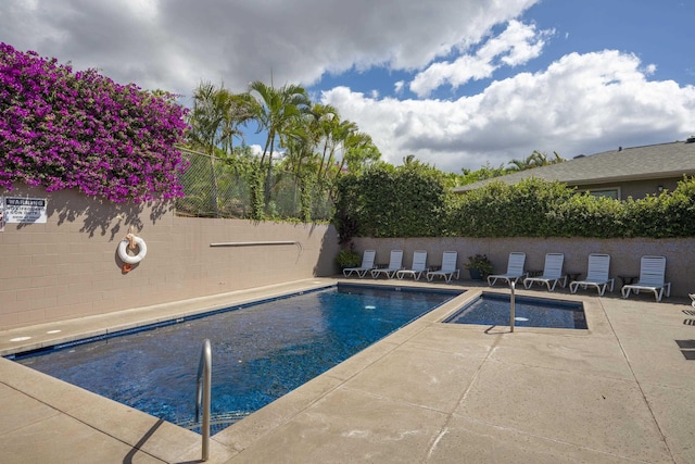 view of swimming pool with fence, a patio area, and a fenced in pool