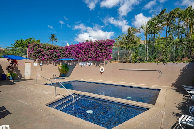 view of swimming pool featuring a patio area