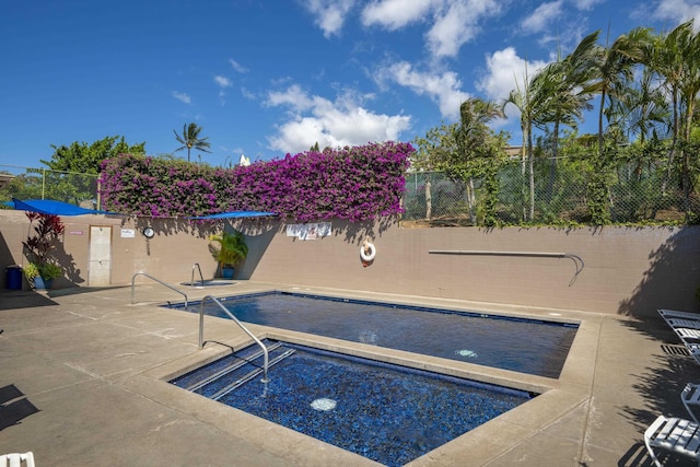 view of pool with a patio, a fenced in pool, and fence