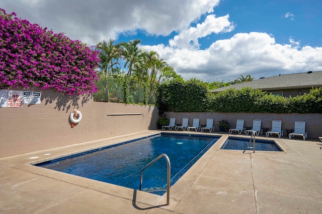 view of swimming pool with a patio