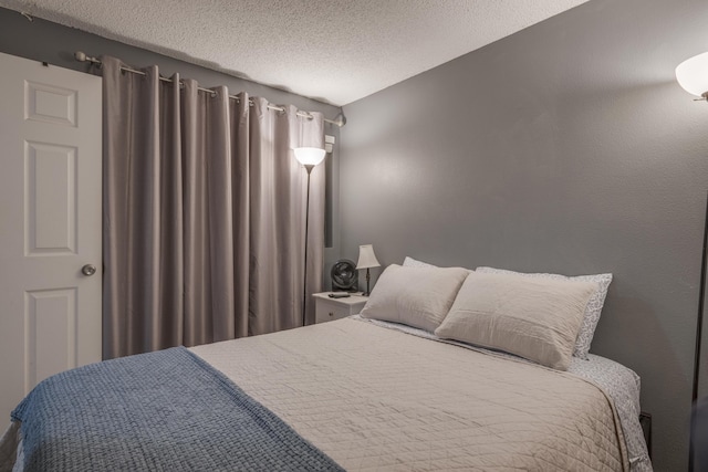 bedroom featuring a textured ceiling