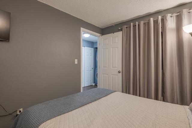 bedroom featuring a textured ceiling