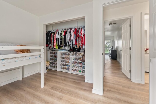 bedroom featuring a closet and wood finished floors