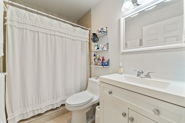 full bath with toilet, decorative backsplash, tile patterned flooring, and vanity