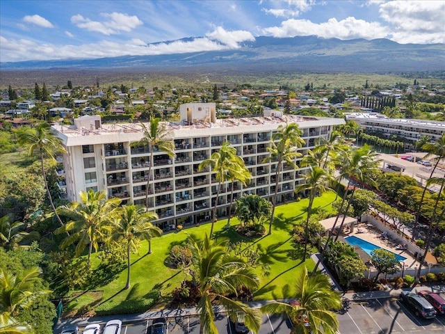 birds eye view of property with a mountain view