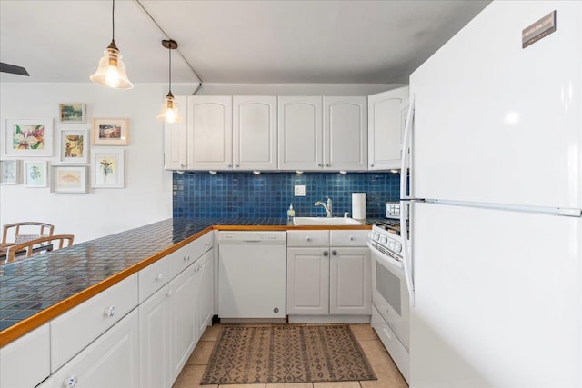 kitchen featuring white cabinetry, sink, white appliances, and decorative backsplash