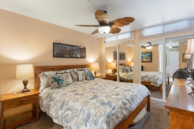 carpeted bedroom featuring multiple closets and ceiling fan