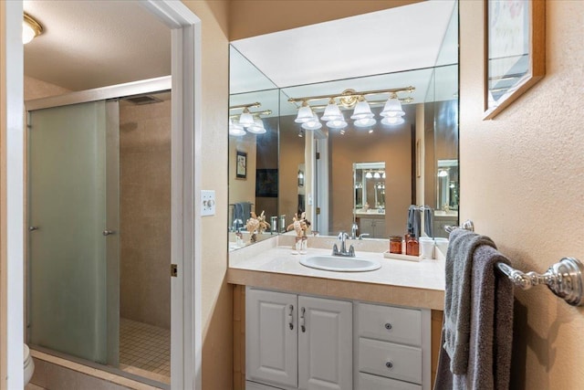 bathroom featuring vanity, toilet, and walk in shower