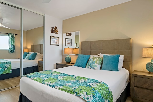 bedroom featuring a closet, ceiling fan, and light wood-type flooring