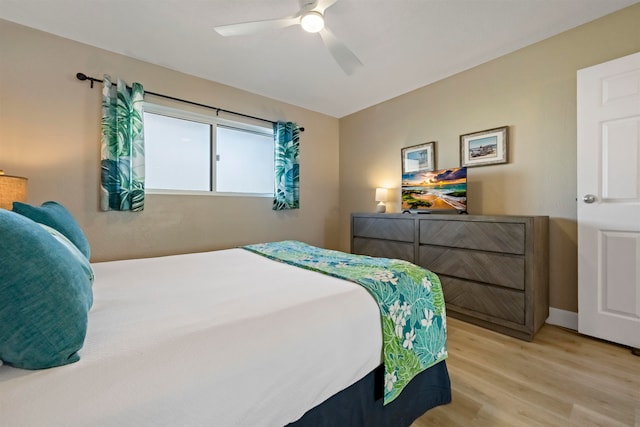 bedroom featuring light hardwood / wood-style flooring and ceiling fan