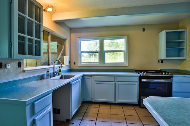 kitchen featuring sink, light tile patterned floors, white cabinetry, and black range with electric stovetop