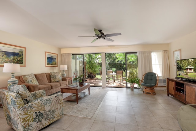 tiled living room featuring ceiling fan and a healthy amount of sunlight