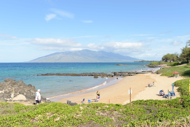 view of water feature featuring a mountain view and a view of the beach