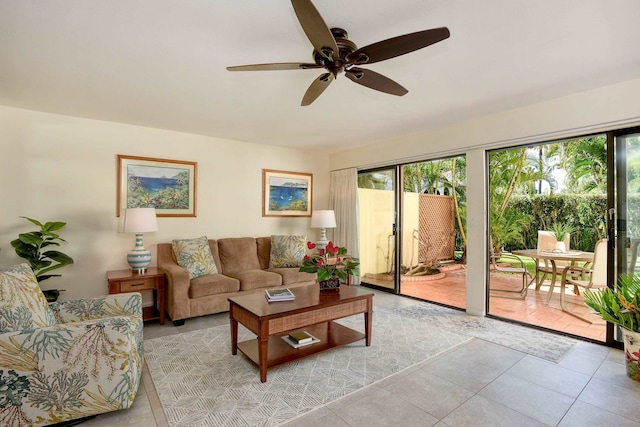 living room featuring ceiling fan and light tile patterned floors