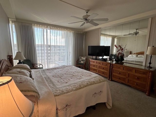 carpeted bedroom featuring ceiling fan