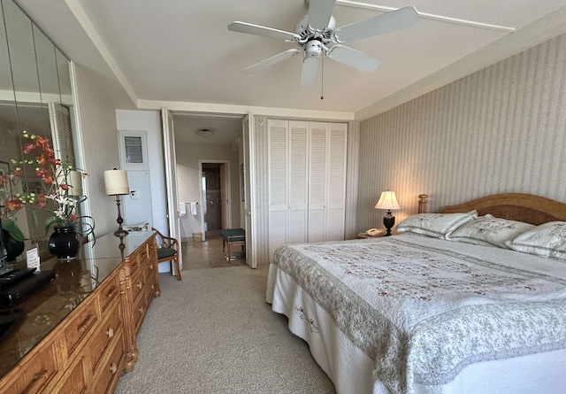 bedroom with ceiling fan and light colored carpet