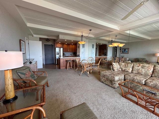 living room with carpet floors, ceiling fan, and beam ceiling