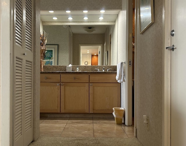 bathroom featuring tile floors and oversized vanity