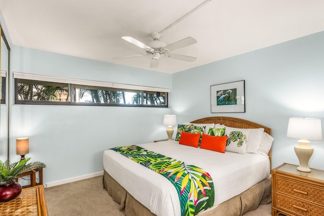 bedroom featuring ceiling fan and light colored carpet