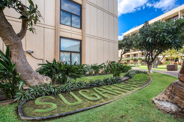 view of side of home featuring a lawn