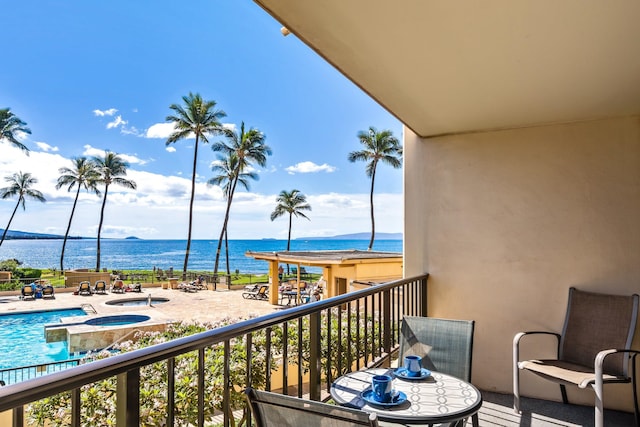 balcony featuring a water view