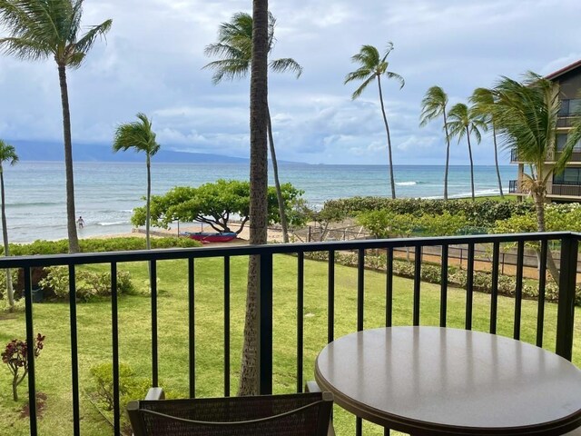 balcony featuring a water view