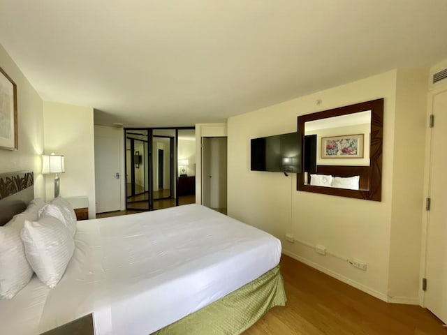 bedroom featuring hardwood / wood-style floors