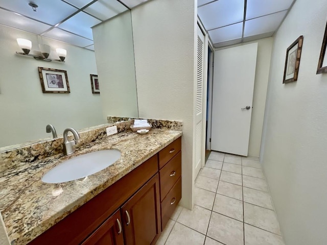 bathroom with tile patterned flooring and vanity