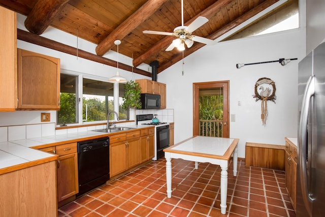 1160 Ehu Rd, Makawao, HI 96768 - kitchen featuring black appliances, tile counters, a wooden ceiling with exposed beams, tasteful backsplash, and a ceiling fan