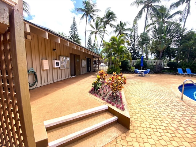 exterior space with a patio area and a pool