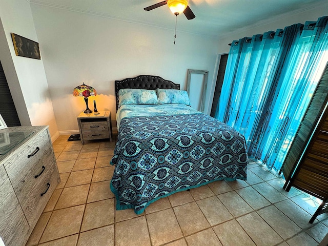 bedroom featuring ceiling fan, light tile patterned floors, and crown molding