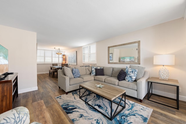 living room featuring baseboards and wood finished floors