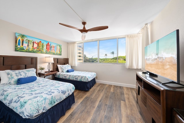 bedroom with ceiling fan and hardwood / wood-style floors