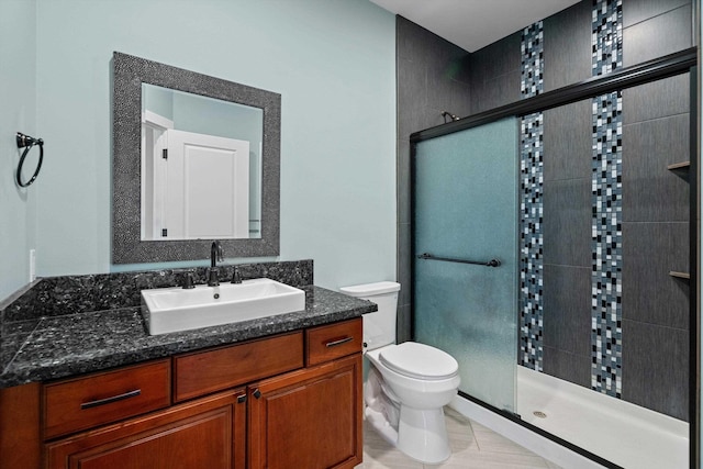 full bathroom with tile patterned flooring, a stall shower, toilet, and vanity