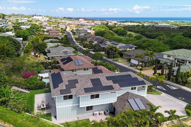 drone / aerial view with a residential view and a water view