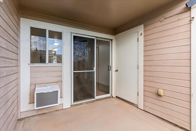 entrance to property featuring a patio area