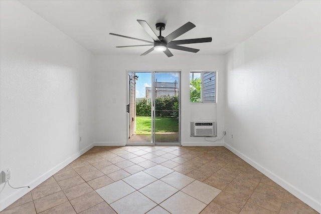 unfurnished room featuring an AC wall unit, ceiling fan, and light tile patterned flooring