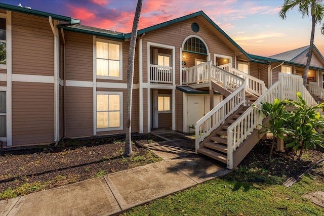 exterior space with stairs and covered porch