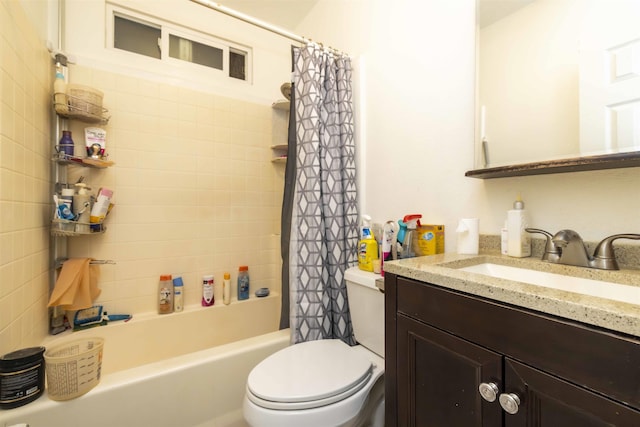 full bathroom with vanity, shower / bath combo with shower curtain, and toilet