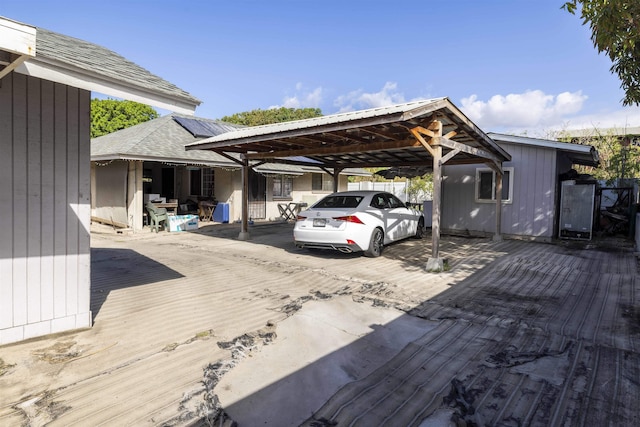 view of parking / parking lot featuring a detached carport
