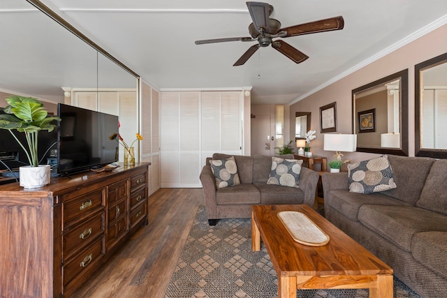 living room featuring dark hardwood / wood-style floors, ceiling fan, and ornamental molding